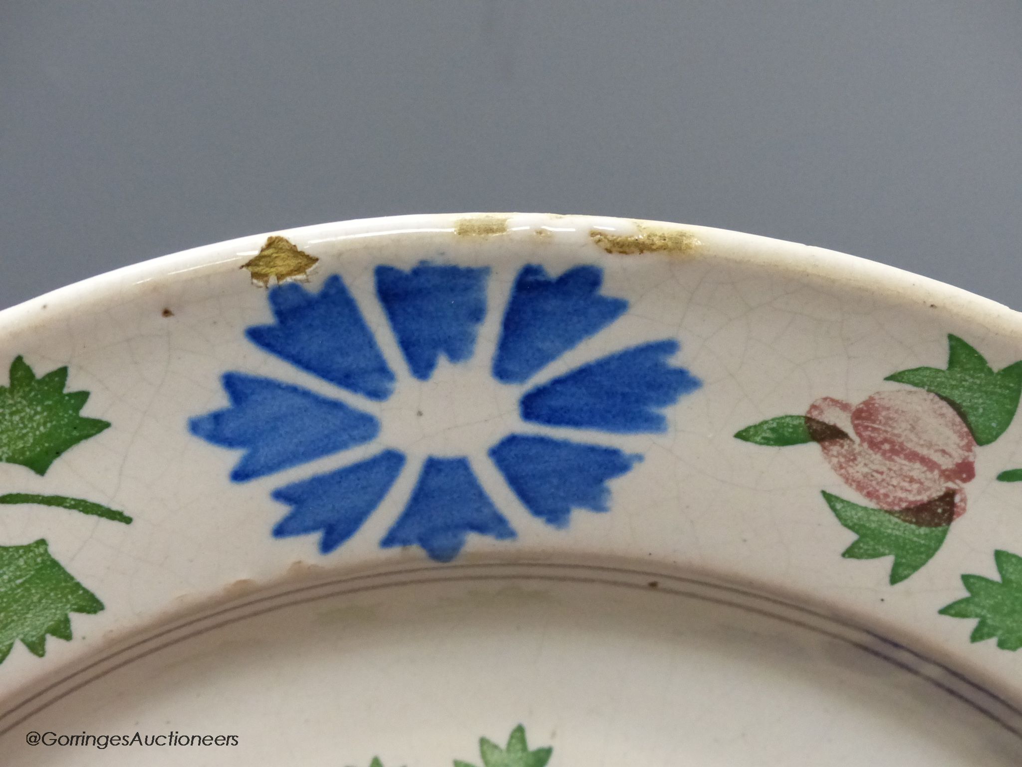 A pair of Continental polychrome faience chargers, late 19th century, height 33cm - one cracked